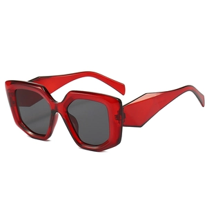 Stylish translucent red oversized geometric polygon sunglasses with dark grey lenses
