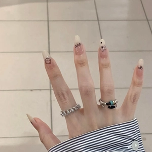 Handmade press-on nails with cute hand-drawn dog cartoons and silver spiral rings