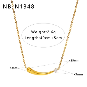 Macro view of gold Y-shaped necklace pendant with 25mm length and 3mm clear stone