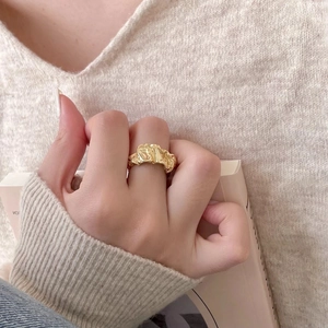 Modern 925 sterling silver gold-plated crumpled foil ring with irregular lava texture