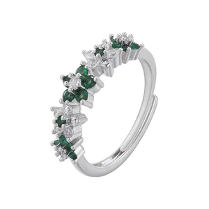 Macro view of adjustable silver ring with green and white cubic zirconia cluster design