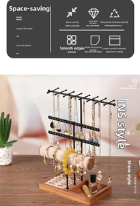 Multi-tier jewelry display stand with wooden base and metal racks for necklaces and watches
