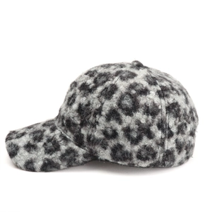 Close-up of leopard print baseball cap in gray plush fabric for winter warmth
