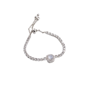 Elegant silver adjustable pearl bracelet with zircon heart and bow details on white background