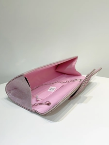 Open pink glitter evening clutch with silver chain strap and matching lining detail