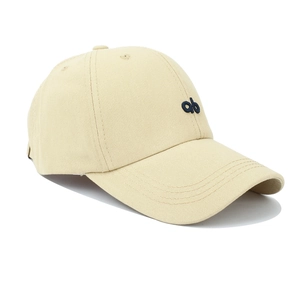 Classic beige cotton baseball cap with blue ab embroidery shown from a 45-degree angle