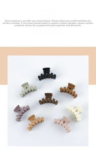 Flat lay of large matte hair claws in 8 Morandi colors including black and beige
