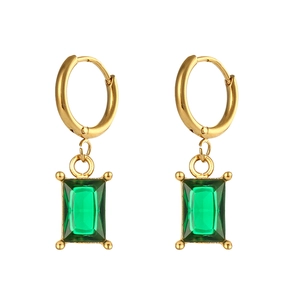 Detailed close-up of emerald green rectangular gem pendant with gold hoop earrings