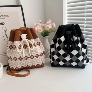 Knitted drawstring bucket bags with diamond patterns in brown and black colorways