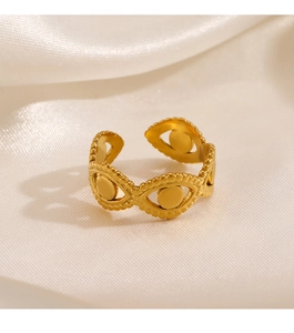 Detail of 18K gold-plated stainless steel evil eye ring on white satin background