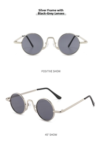 Close-up of retro silver metal round sunglasses with dark grey lenses in two angles