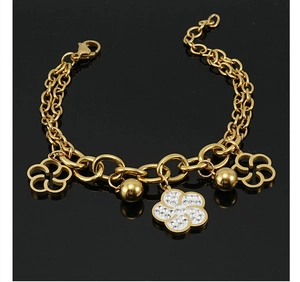 Detail of rose gold titanium flower bracelet with sparkling diamonds on a black base