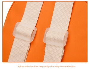 Close-up of adjustable white woven shoulder straps on an orange kids backpack