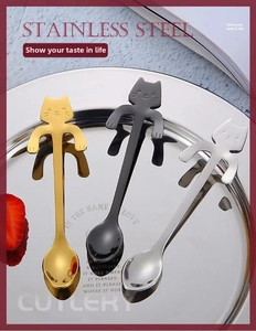Detailed view of 304 stainless steel cat-shaped hanging spoons in gold, black, and silver