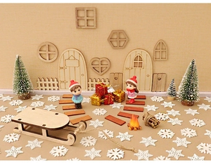 Miniature wooden Christmas set with sled, door, fence, and festive decor details