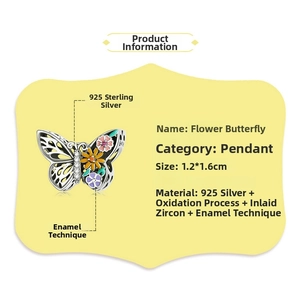 Macro detail of a 925 sterling silver butterfly charm with colorful enamel and zircon stones