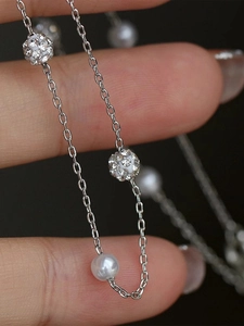 Elegant silver stainless steel Y-shaped necklace with pearls and crystal-paved sphere charms