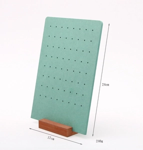 Detailed view of green jewelry display board with wood base and dimension labels