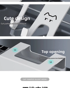 Detail of cat shaped silent hook showing metal texture and mounting hole on white surface