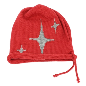 Detailed knit texture of red beanie with silver star patterns and side drawstring cords