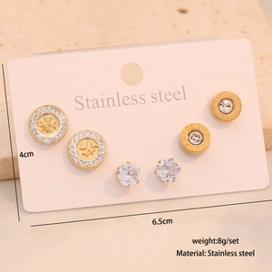 Three pairs of stainless steel stud earrings set on a display card with size details
