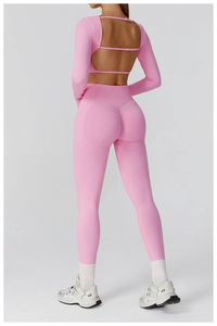 Back view of pink seamless yoga set showing open back top and high waist leggings