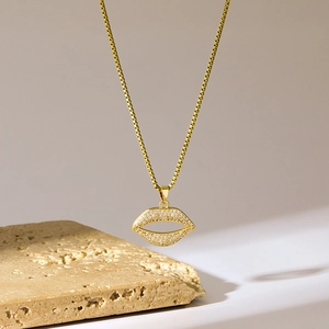 Gold-plated hollow lip pendant necklace set with sparkling micro-pave zircons