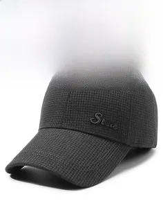 Detail of grey plaid warm winter cap featuring stylish 3D State letter embroidery