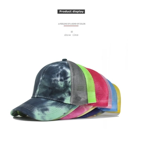 Close-up of vibrant tie-dye baseball caps featuring breathable mesh back and curved brim