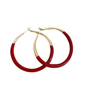 Minimalist red enamel hoop earrings in golden stainless steel with a bold round design