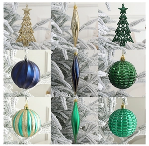 Detailed view of various glitter and matte Christmas tree ornaments in a grid layout