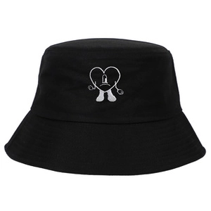 Close-up of black cotton bucket hat featuring white embroidered heart character logo