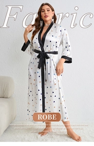 Detail of satin robe featuring colorful heart print and contrasting black trim details