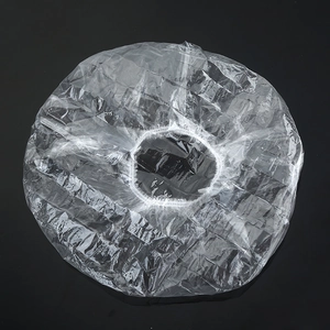 Macro detail of elastic clear food-grade cling film covers for household food storage
