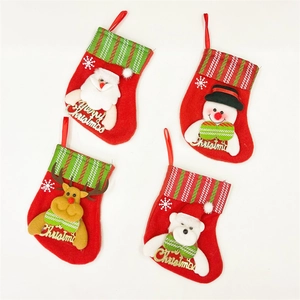 Detailed view of four mini Christmas stockings with Santa, Snowman, Reindeer, and Bear