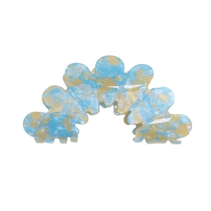 Blue and beige marble pattern acetate hair claw clip with a large petal design on white background