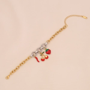 Detail of stainless steel gold and silver chain with strawberry and cherry pendants