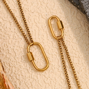 Minimalist 18K gold plated stainless steel necklace with oval lobster clasp on textured surface