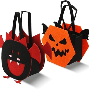 Halloween felt treat bags featuring orange pumpkin and red monster designs for kids
