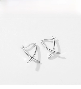 Macro shot of S925 sterling silver stamp on the polished geometric crisscross earrings