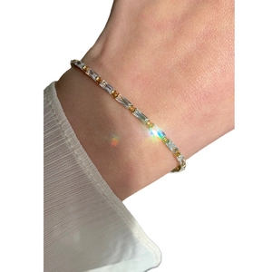 Elegant gold-plated tennis bracelet featuring rectangular AAA zircons on a female wrist