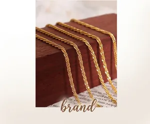Close-up of golden twist rope chain with detailed metallic texture and polished finish