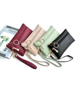 Detailed set of four PU leather pouches with gold zippers and matching wrist straps