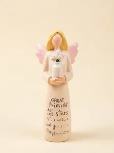 Detailed view of friendship angel resin figurine with wings and emotional quote