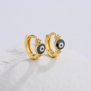 18K gold-plated Evil Eye hoop earrings with zircon and enamel on a white stone background