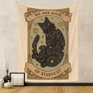 Detail of bohemian cat tapestry with gold stars and We Are Made Of Stardust text