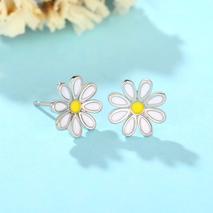 Elegant white daisy flower stud earrings with yellow center on light blue background