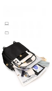 Detailed interior of black nylon laptop backpack with multiple storage compartments