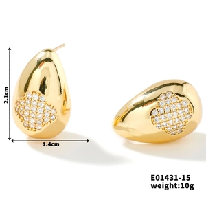 Detail view of gold teardrop earrings with floral zircon inlay and size dimensions