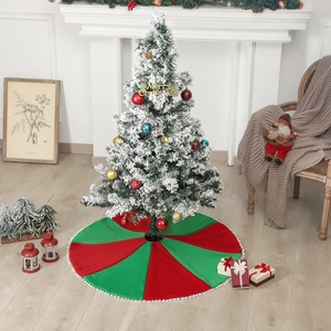 Classic red and green Christmas tree skirt with white pom-pom trim for holiday home decor